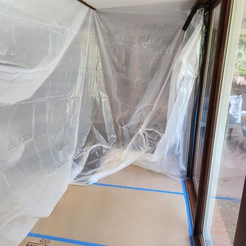 Cardboard and plastic sheeting containment